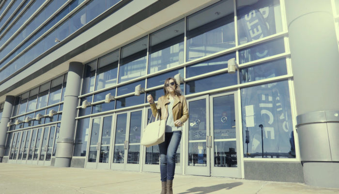 A woman exiting the Enterprise Center.